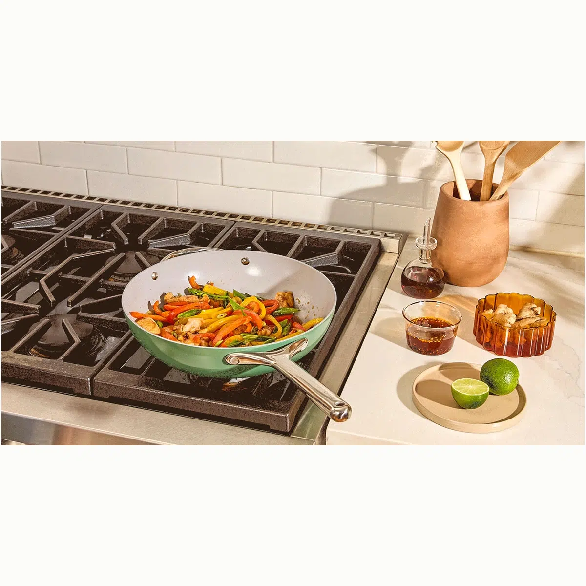 caraway-12-ceramic-coated-non-toxic-stir-fry-pan-with-lid-all-stovetop-compatibl image 1